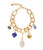 Gold Porto Chain on white with five mood charms attached, including Rainbow Oasis Charm.