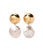 Rodan Pearl Earrings. With oversized gold-plated brass discs and pearly nautilus shell drops.