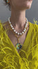 Video of model in yellow feather sweater wearing Pacifica Pearl Collar and other jewels