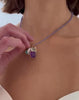 Video of model wearing Tiny Tanzanite & 14K Gold Necklace with assorted charms including Alphabet Soup "J" Charm.