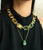 Close-up of model in black top, wearing Vert Collar and Constance Necklace in Green Jade.