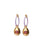 Grove Hoops in Lavender. Light purple enameled hoop earrings with gold drop charms and faceted pink rhodolite stones.