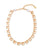 Lisboa Collar in Peach. Linked necklace of gold-plated brass set with light peach square-cut glass and pearls at closure. 