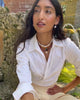 Video of model wearing the pearl Pablo earrings in pink amethyst with the vizcaya necklace.